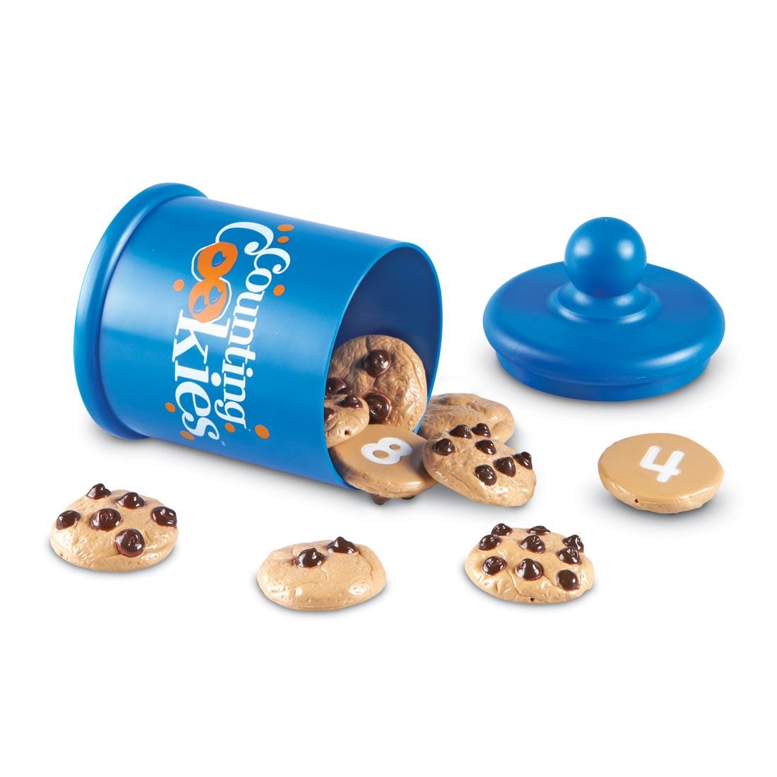 blue cookie jar spilling out plastic chocolate chip cookies that have numbers on the backs