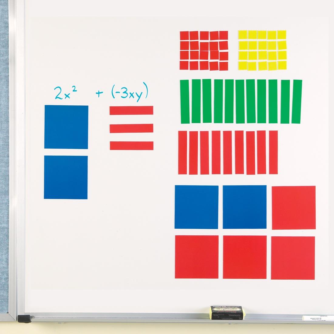 Magnetic Algebra Tiles By Learning Resources in use on a whiteboard