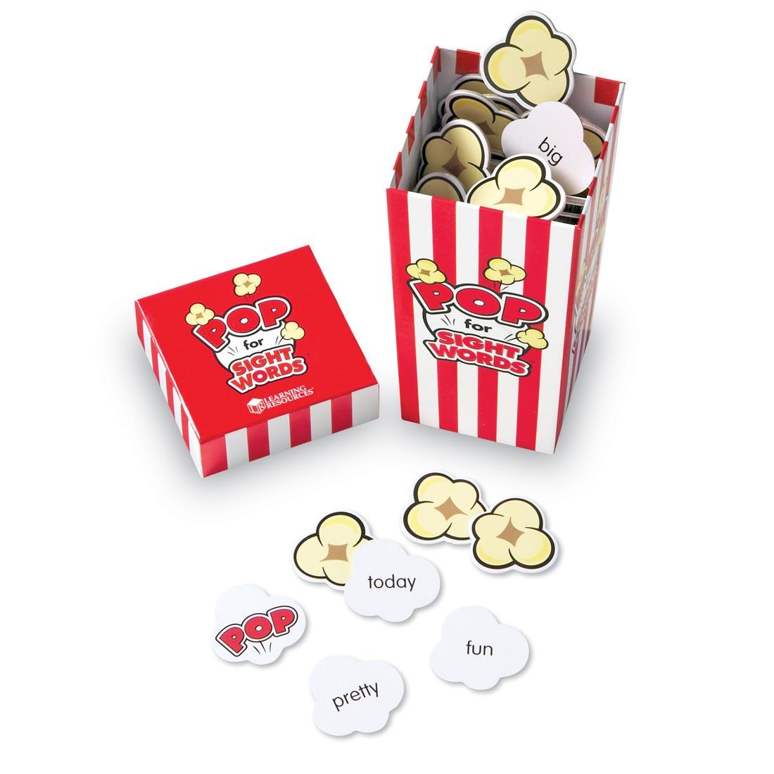 popcorn-shaped cards with sight words on them, in a red and white striped box