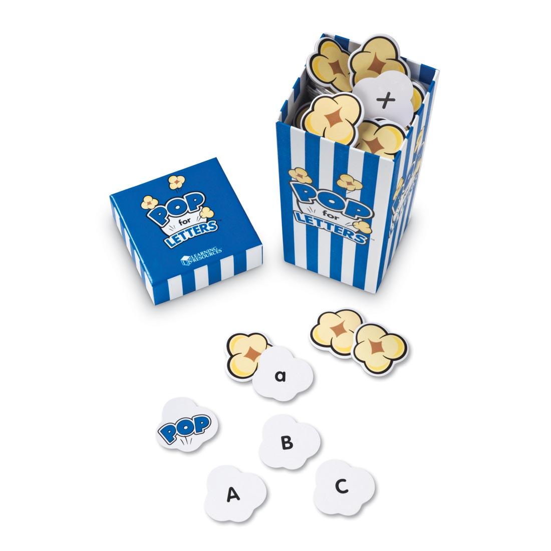 popcorn-shaped cards with letters on them, in a blue and white striped box