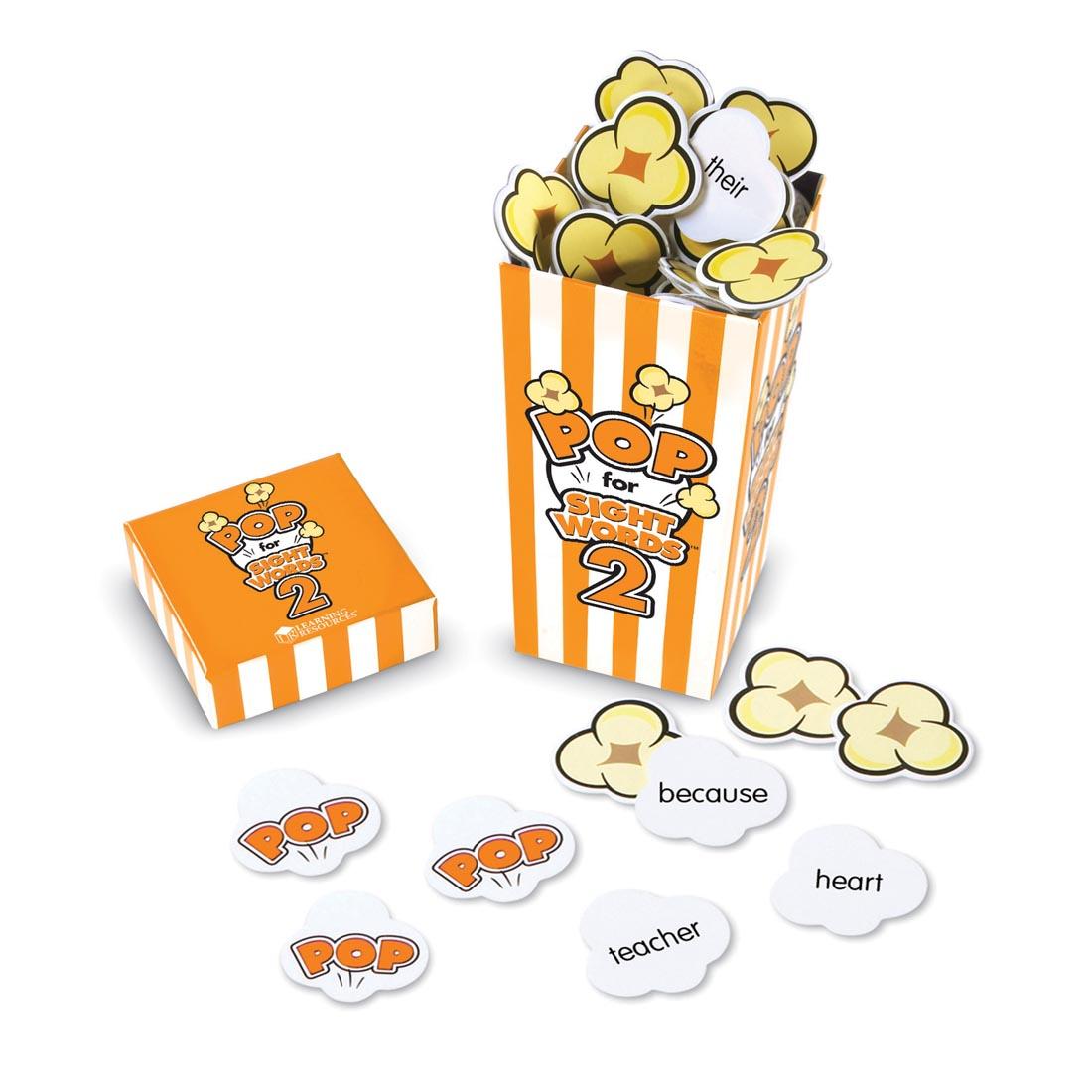 popcorn-shaped cards with sight words on them, in a yellow and white striped box