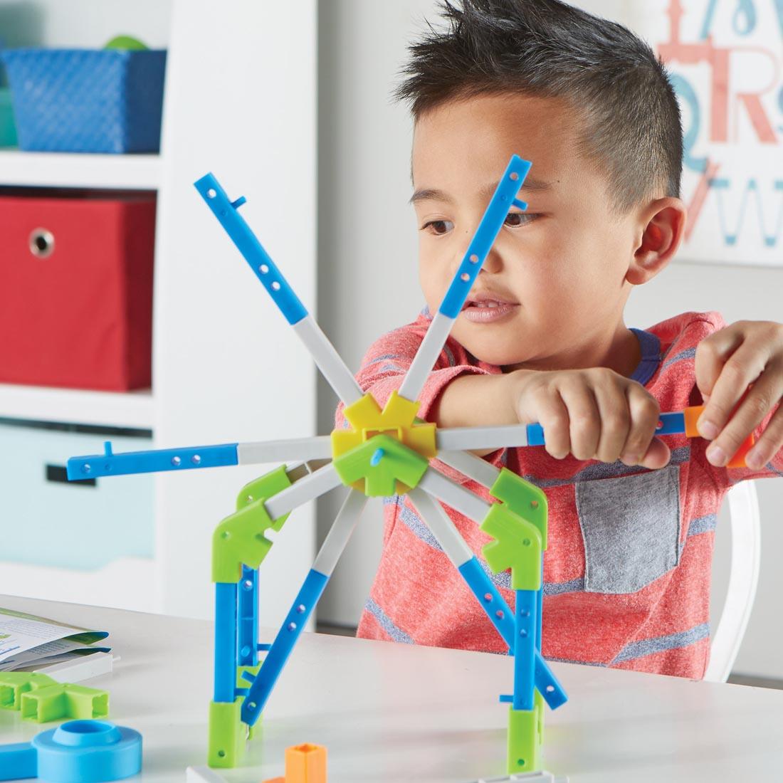 child building with the STEM Explorers Motioneering Set