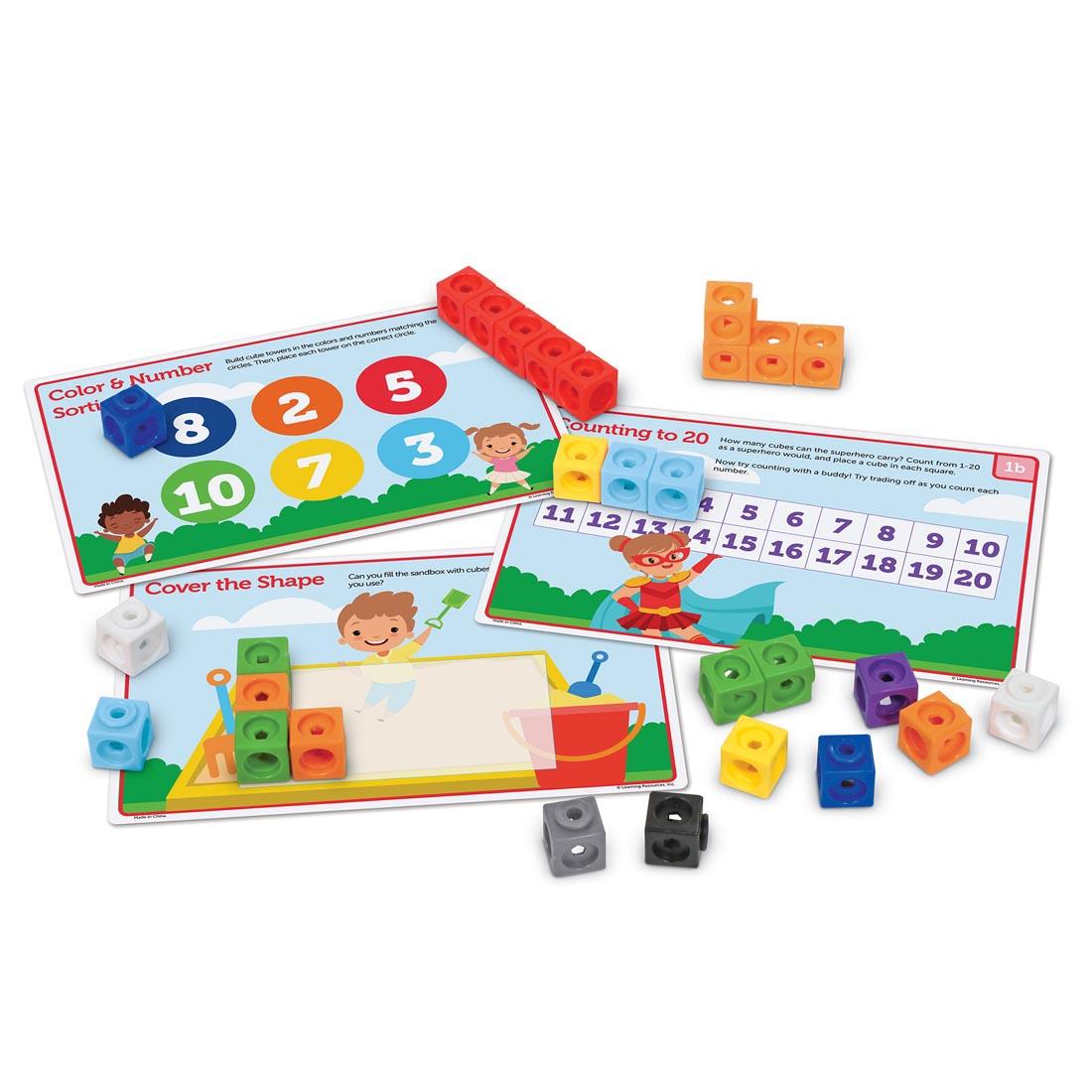 Some activity cards and cubes from the MathLink Cubes PreK Activity Set By Learning Resources