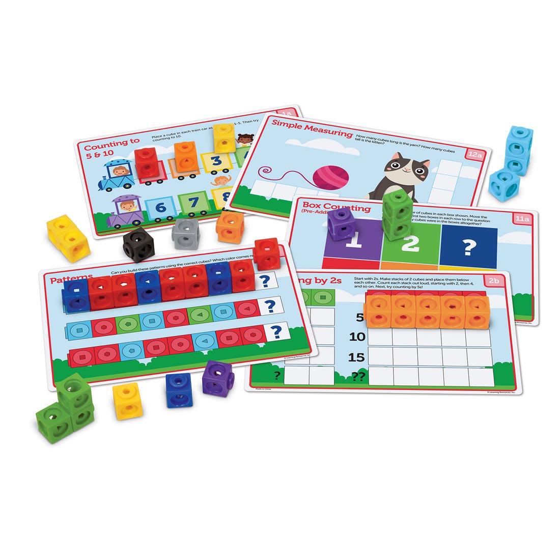 Some activity cards and cubes from the MathLink Cubes PreK Activity Set By Learning Resources