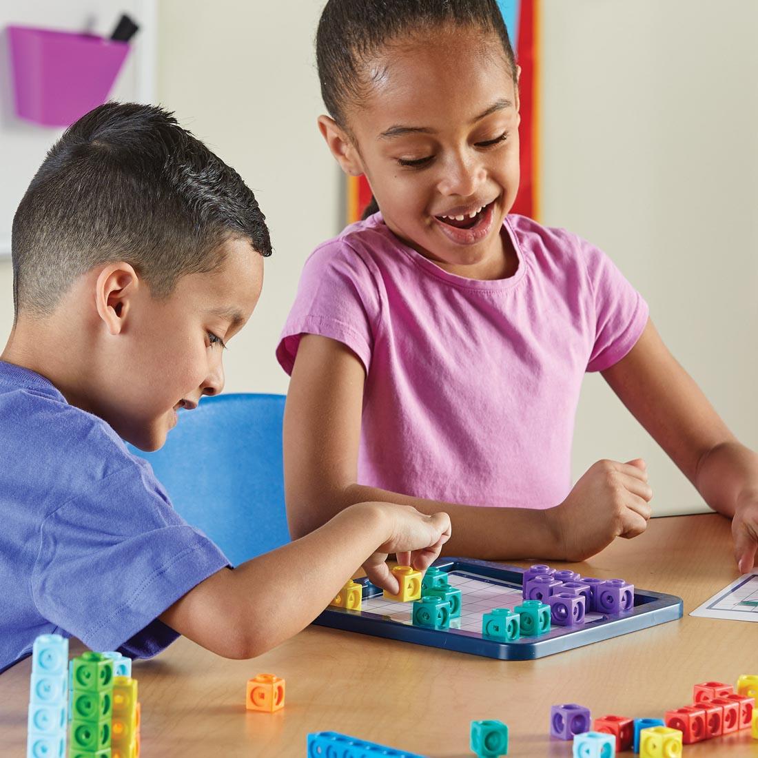 two children playing with MathLink Cubes Brain Puzzle Challenge