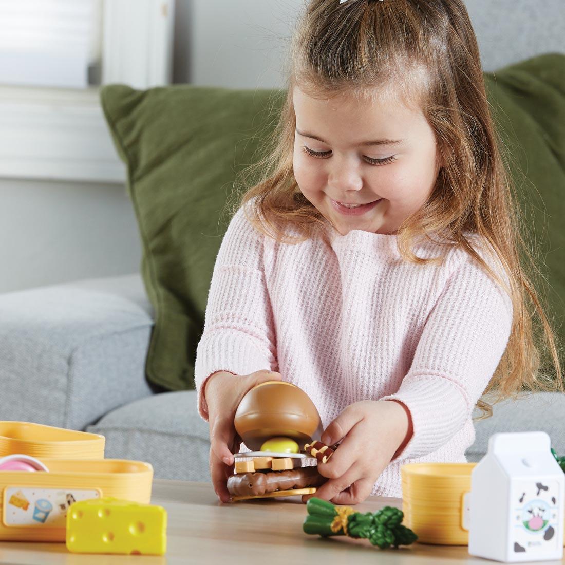 child playing with the New Sprouts Pick 'n' Sort Food Groups