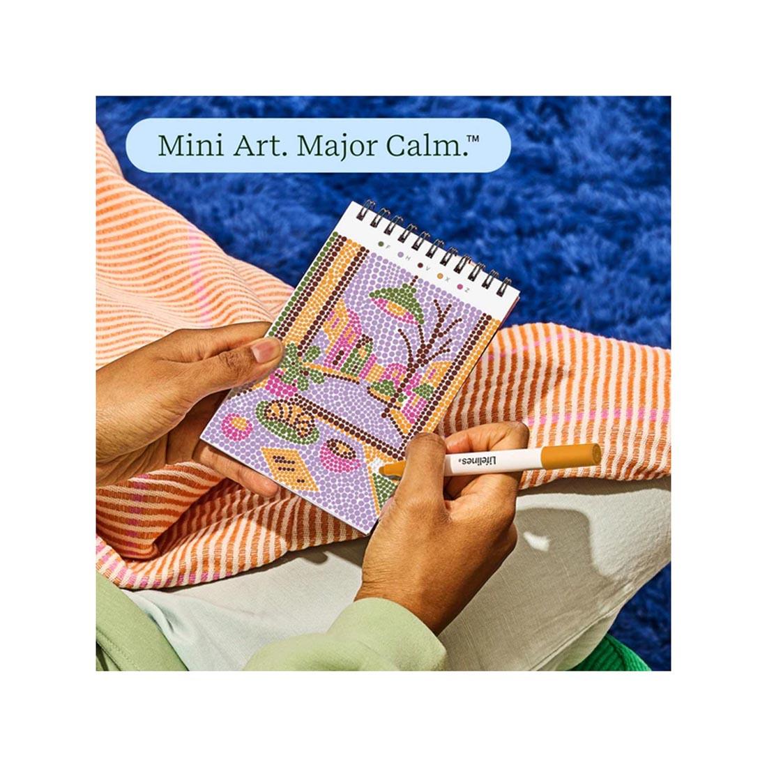 hands working on completing an image in Café Comforts Mini Dot-By-Letter FlowArt plus text Mini Art. Major Calm.