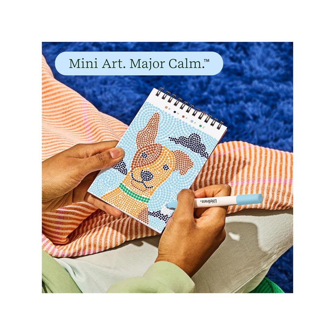 hands working on completing an image in Furry Friends Mini Dot-By-Letter FlowArt by Lifelines plus text Mini Art. Major Calm.