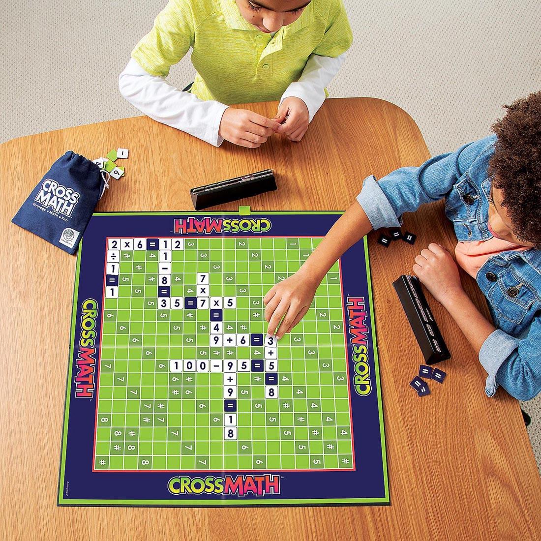 two children playing the CrossMath Game By Mindware