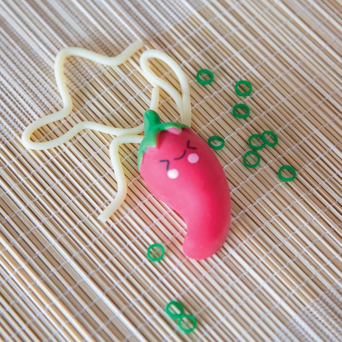 close up of noodle, squishy pepper and scallions pieces from the Foodie Fidgets Ramen Noodles and Toppings set