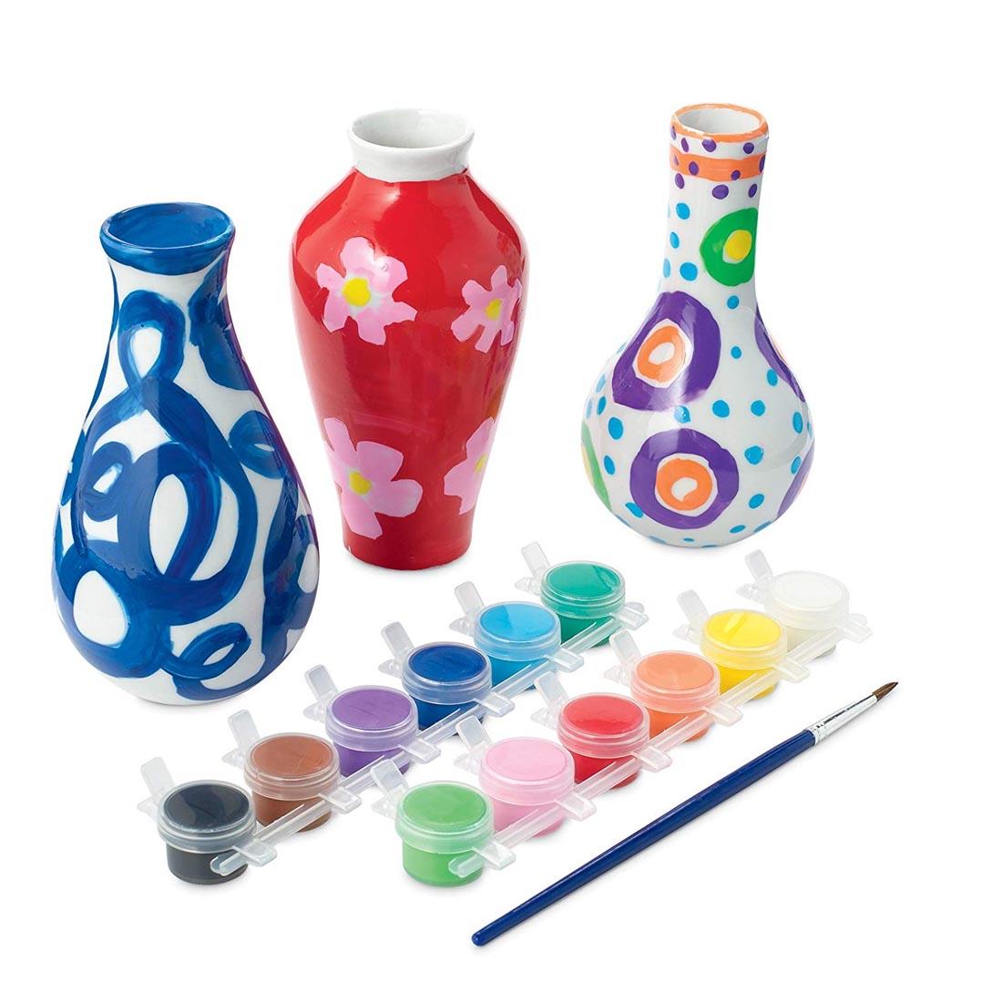 Completed projects from the Paint Your Own Porcelain Vases Kit
