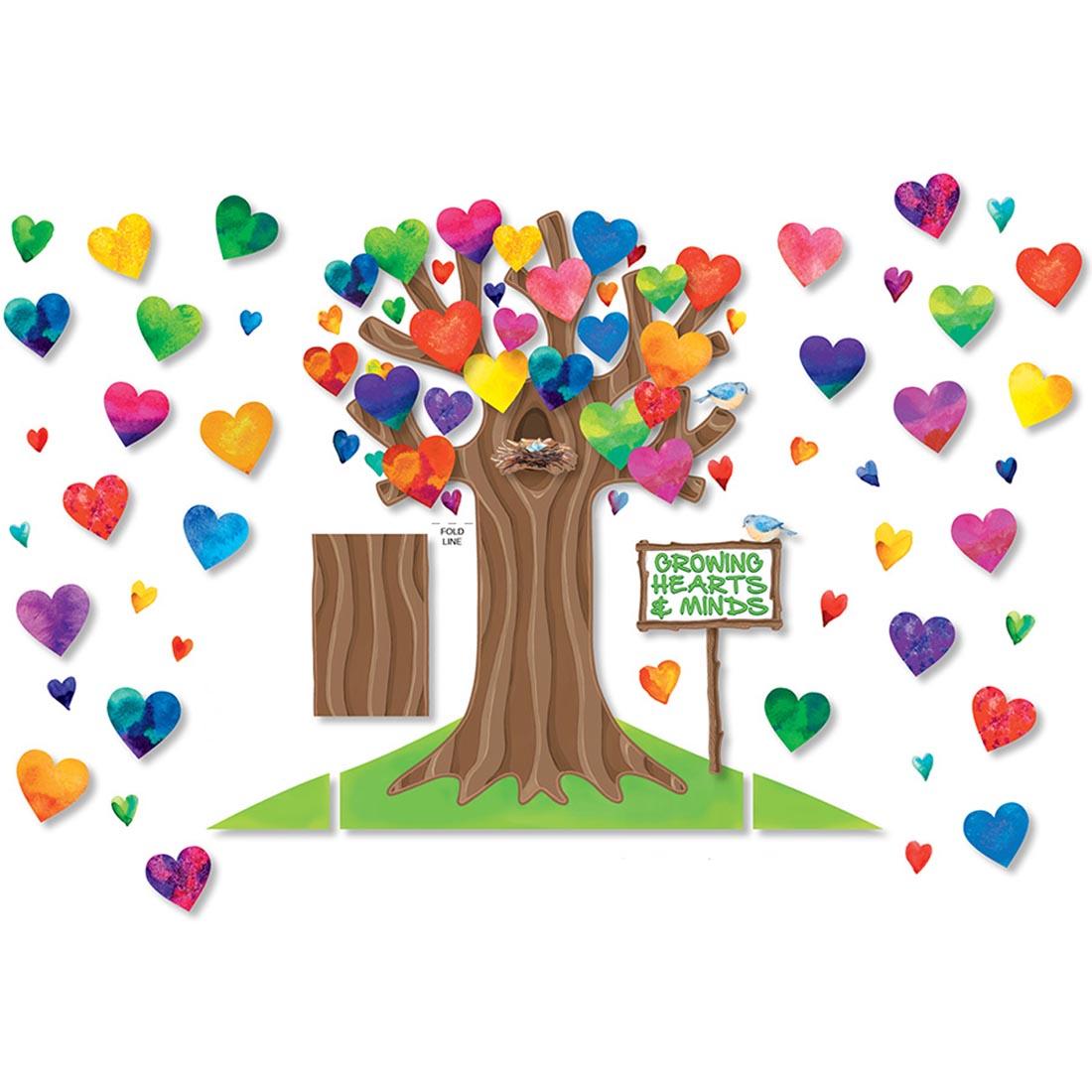 bulletin board set featuring large tree and colorful hearts