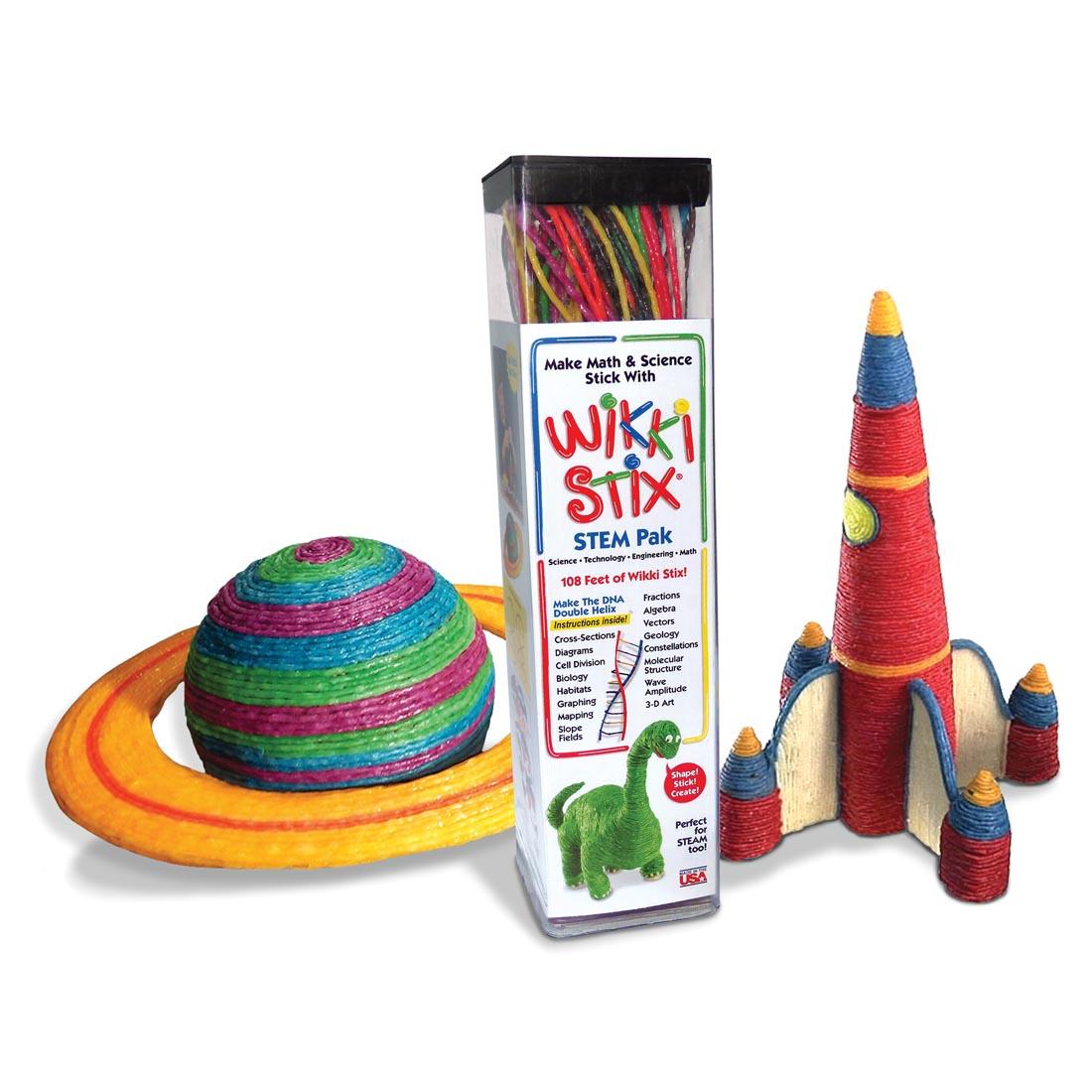 planet and rocket ship made of wax-coated yarn pieces, also called wikki stix