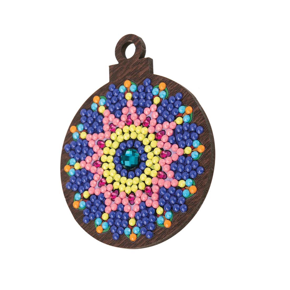 a completed example ornament from the Crystal Art Mandala Mayhem Wooden Hanging Decoration Kit