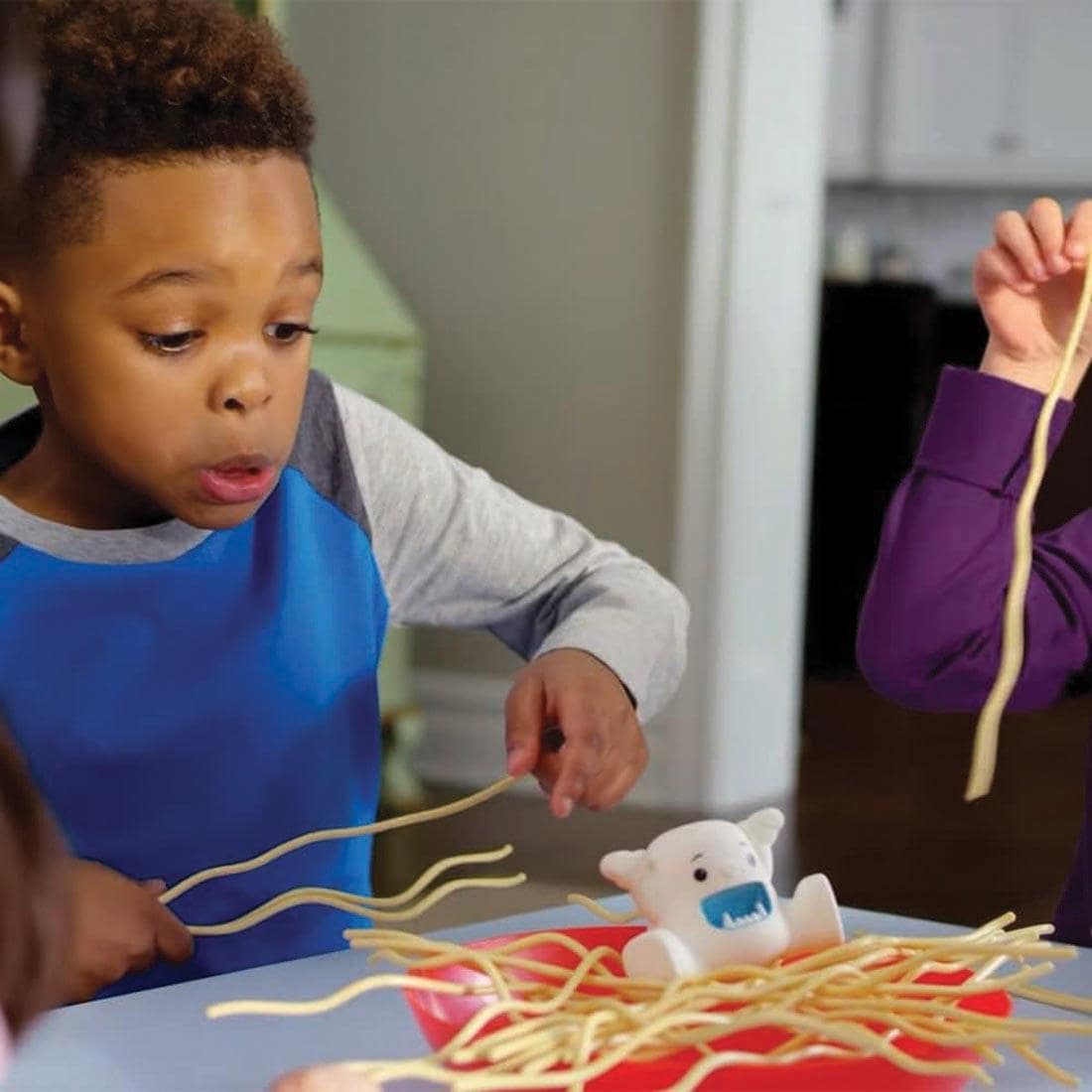 young child pkaying Yeti In My Spaghetti game, facial expression shows he hopes the Yeti doesn't fall