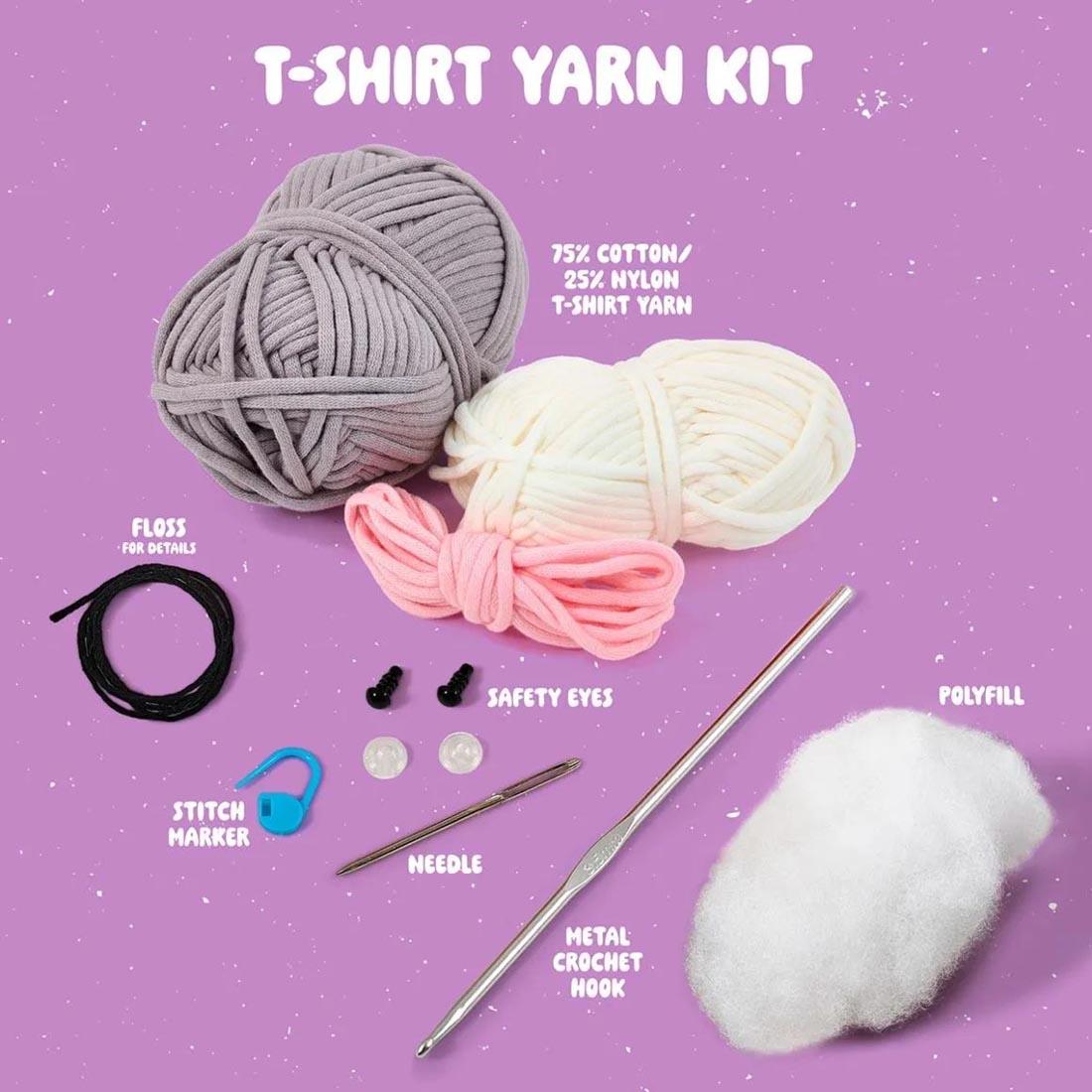 components of Caylee The Cat Complete Crochet Kit labeled: T-Shirt Yarn Kit; 75% Cotton/25% Nylon T-Shirt Yarn; Floss For Details; Safety Eyes; Stitch Marker; Needle; Metal Crochet Hook; Polyfill