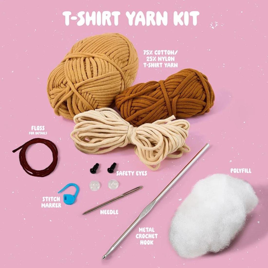 components of Dion The Dog Complete Crochet Kit labeled: T-Shirt Yarn Kit; 75% Cotton/25% Nylon T-Shirt Yarn; Floss For Details; Safety Eyes; Stitch Marker; Needle; Metal Crochet Hook; Polyfill