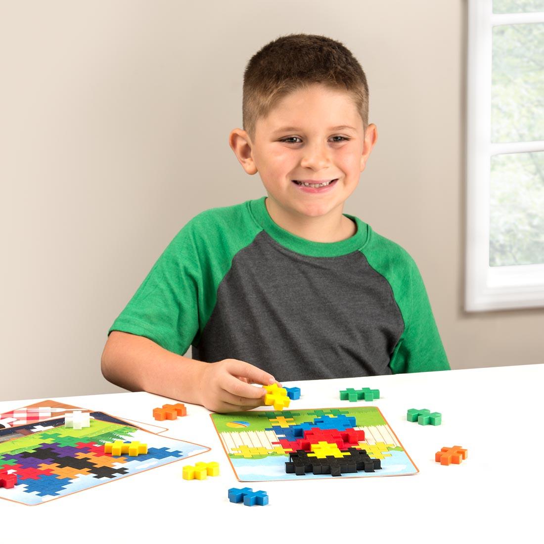 child playing with Plus-Plus BIG 60-Piece Basic Picture Puzzles