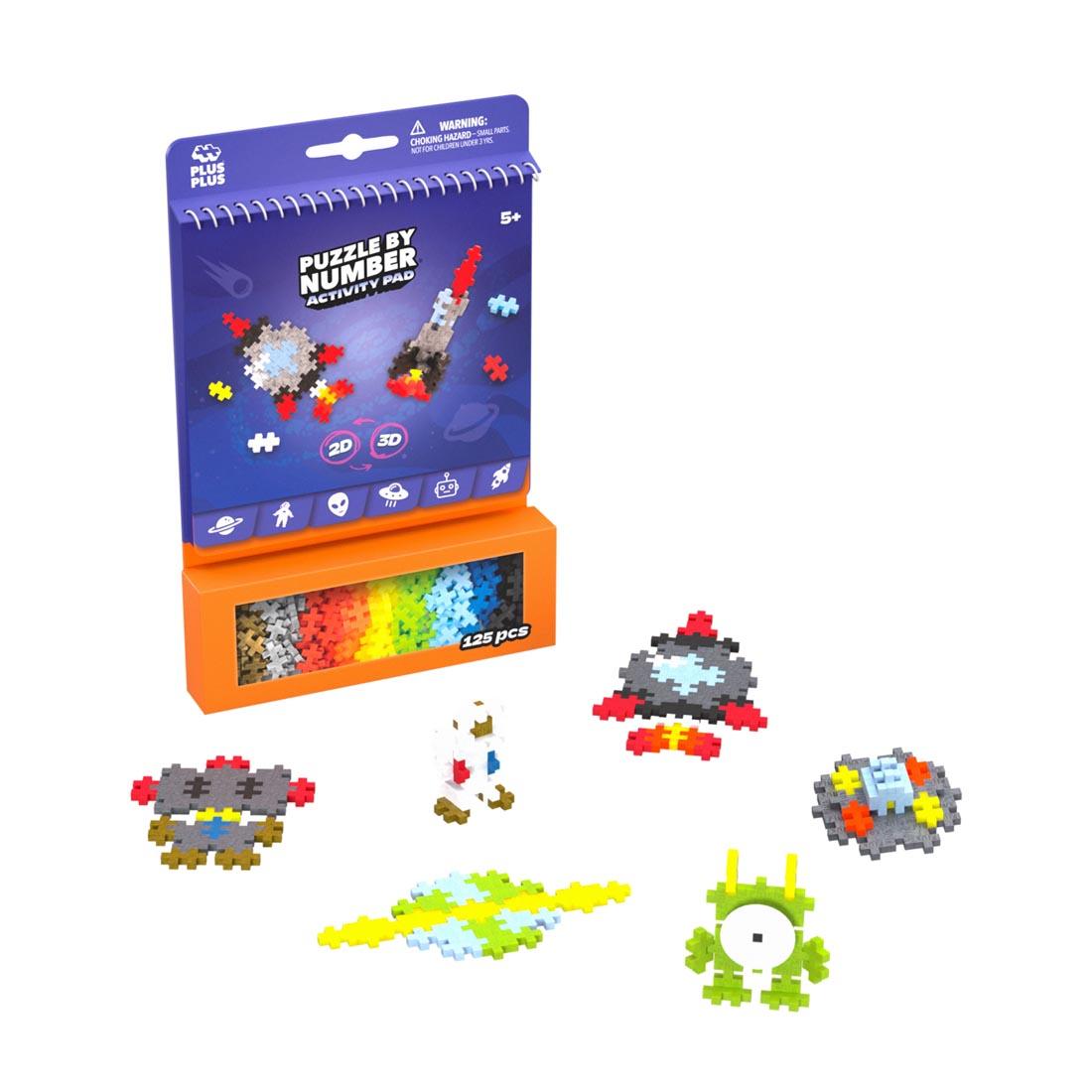 package of Plus-Plus Puzzle By Number Space Activity Pad plus some example creations