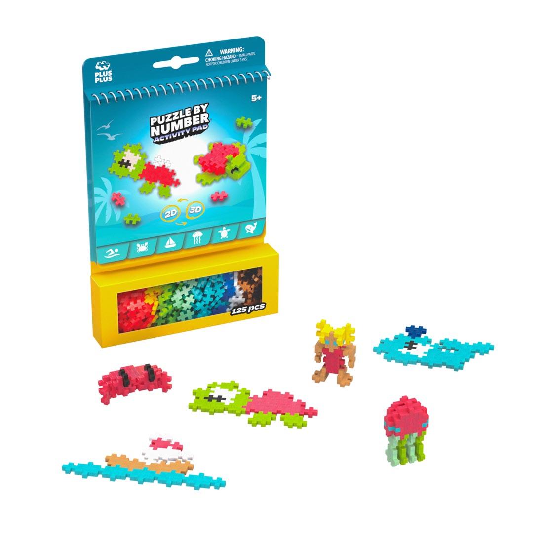 package of Plus-Plus Puzzle By Number Ocean Activity Pad plus some example creations
