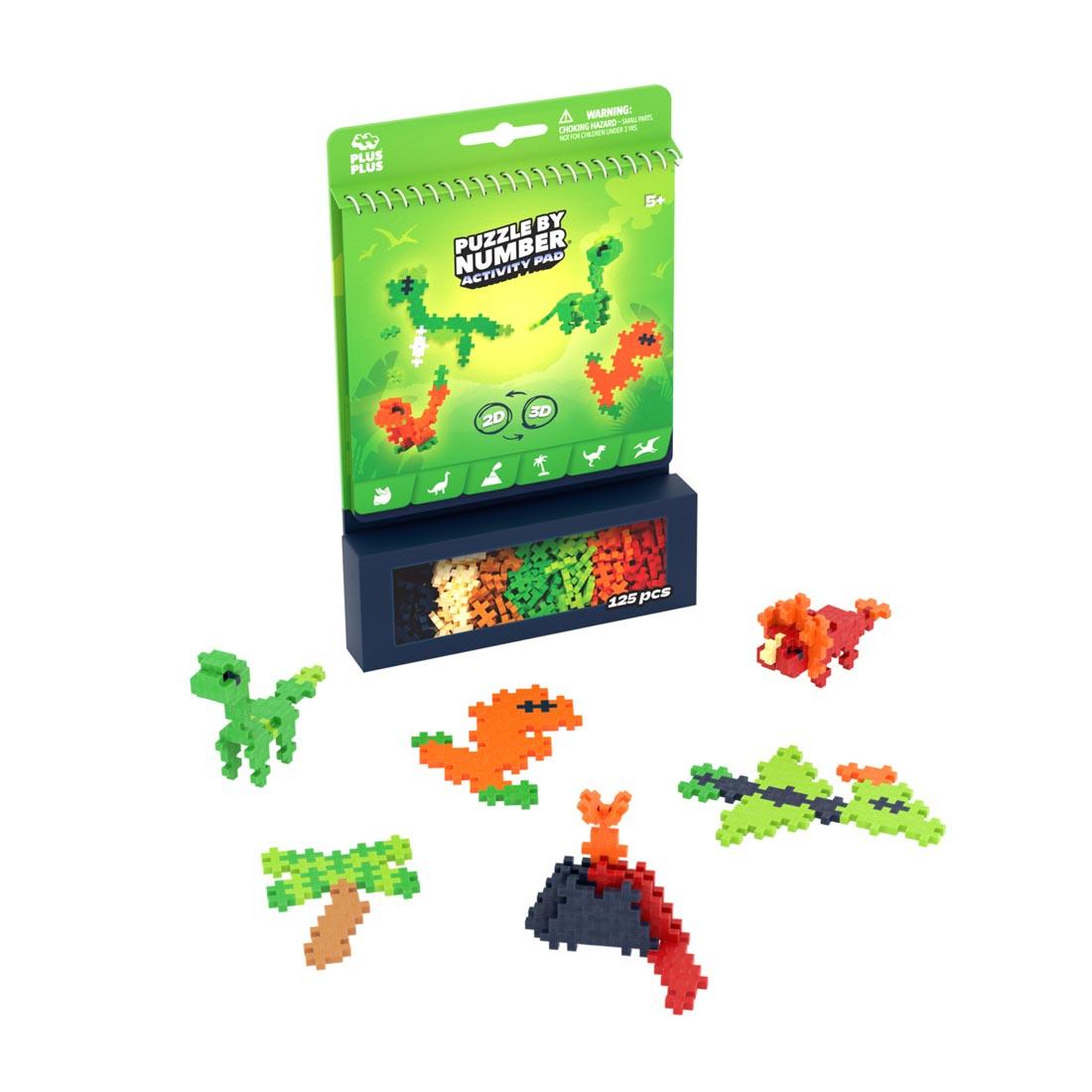 package of Plus-Plus Puzzle By Number Dinosaur Activity Pad plus some example creations