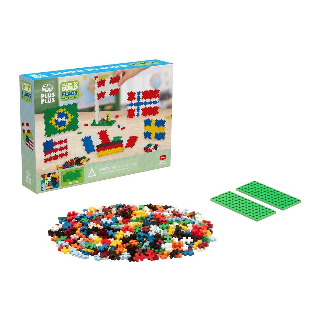 box for Plus-Plus Learn To Build Flags Of The World Set behind pile of pieces and base plates