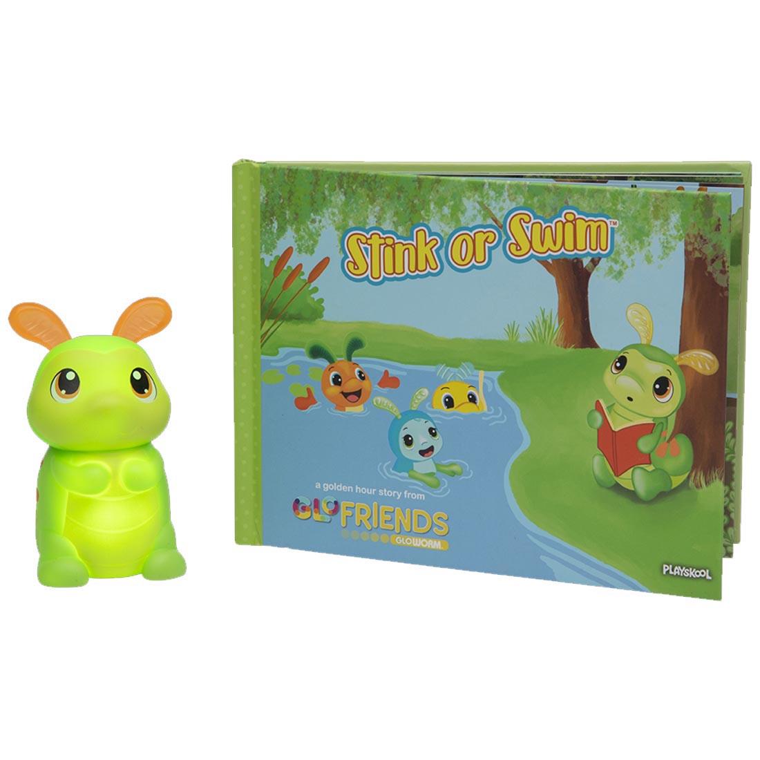 front cover of the Stink Or Swim book beside the Bookworm toy