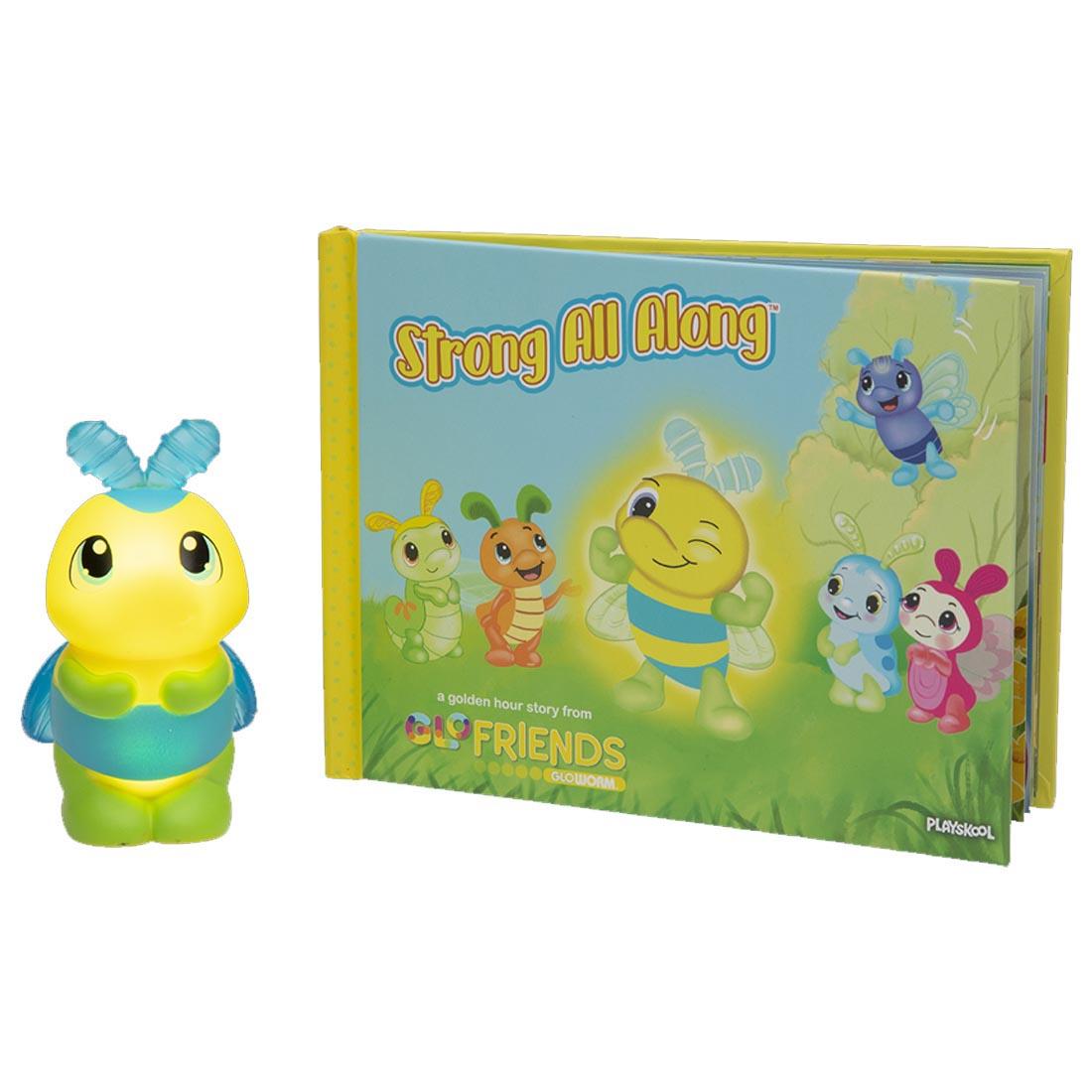 front cover of the Strong All Along book beside the Bumblebug toy