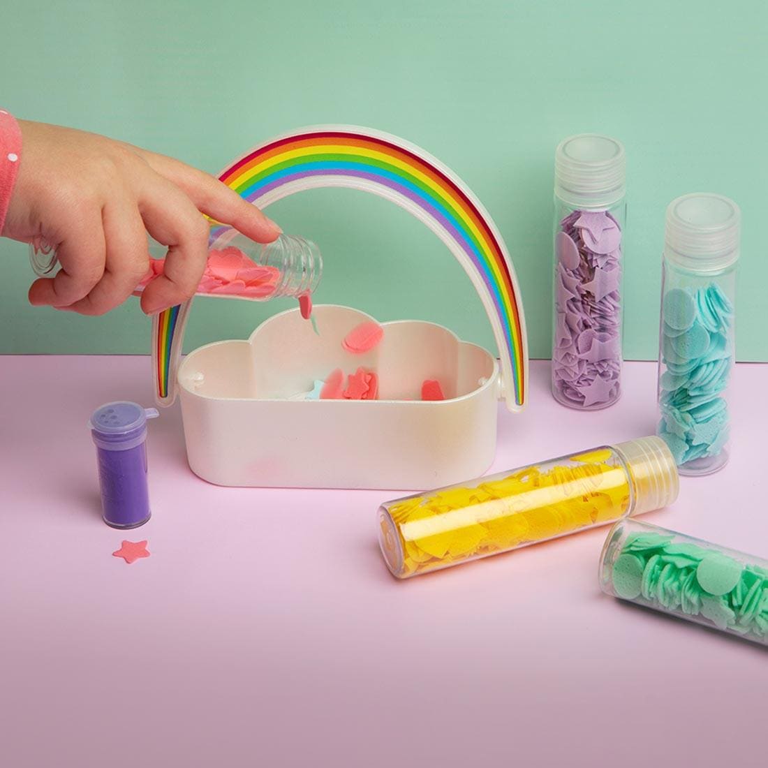 soap confetti vials, with one being poured into the bubble maker tray