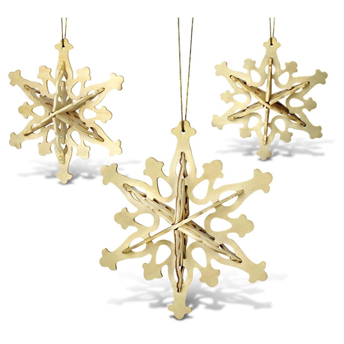 Completed examples of Snowflake Ornaments 3D Wooden Puzzles by Puzzled Inc