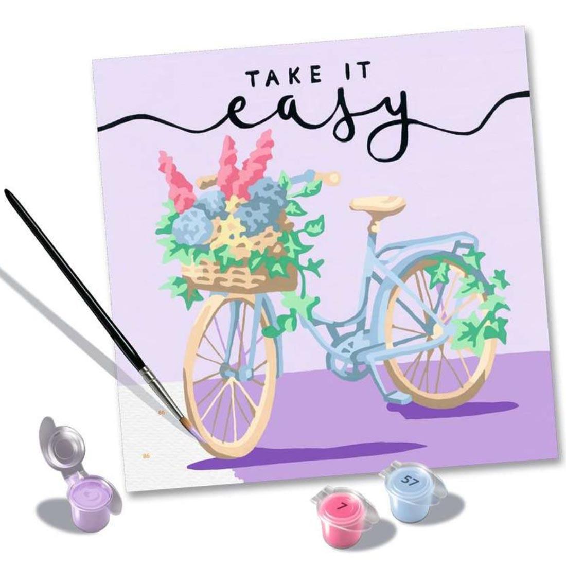 3 paint cups and a brush beside an almost finished painting from the Take It Easy Adult Paint By Number Set By Ravensburger