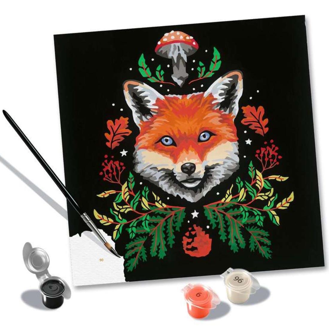 3 paint cups and a paintbrush beside an almost finished painting from the Pixie Cold: Fox Adult Paint By Number Set By Ravensburger
