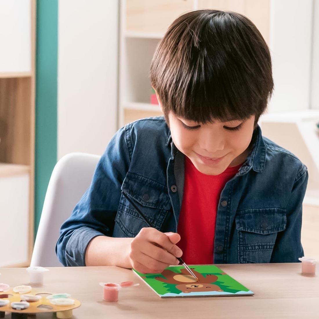 child using the Wild Bear Kids Paint By Number Set By Ravensburger