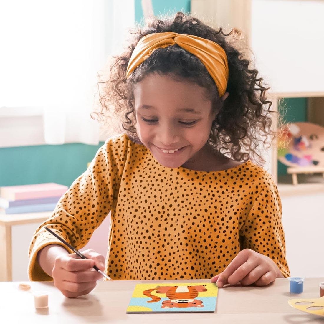 child using the Wild Tiger Kids Paint By Number Set By Ravensburger