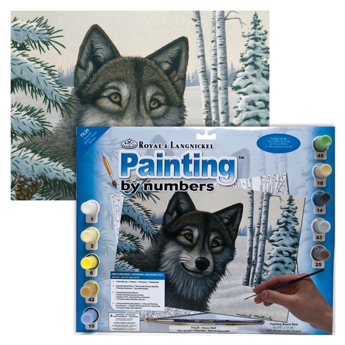 Royal & Langnickel Painting By Numbers Junior Large: Snow Wolf Package with a completed painting behind it