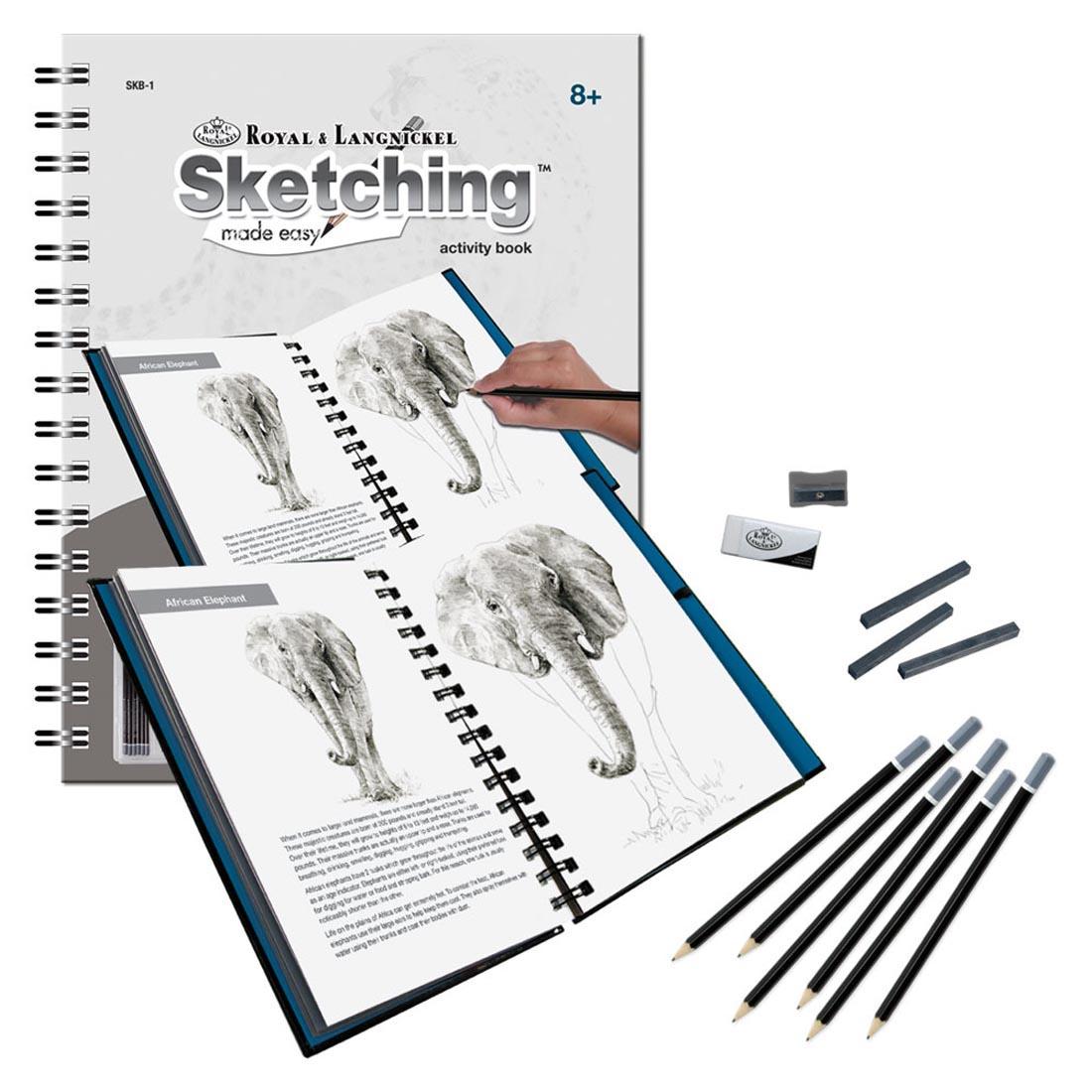 Royal & Langnickel Sketching Made Easy Activity Book shown both closed and open with the included graphite pencils, sketching sticks, eraser and sharpener