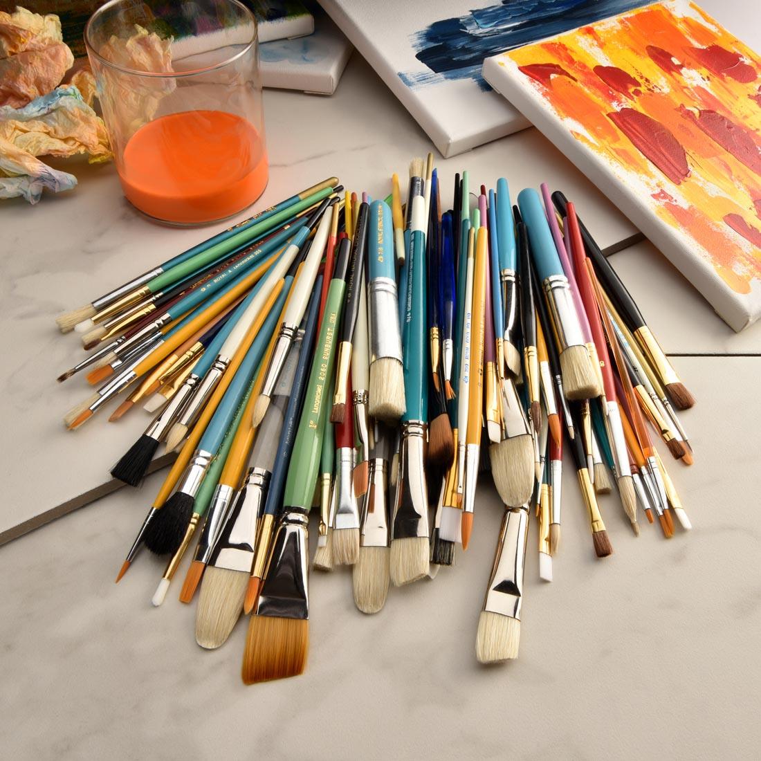 pile of Scratch And Dent Brushes by Royal & Langnickel among other art materials