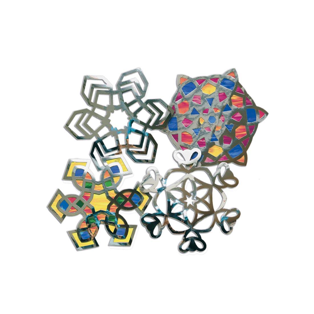 Roylco Snowflake Silver Stained Glass Frames in 4 designs, two are completed examples
