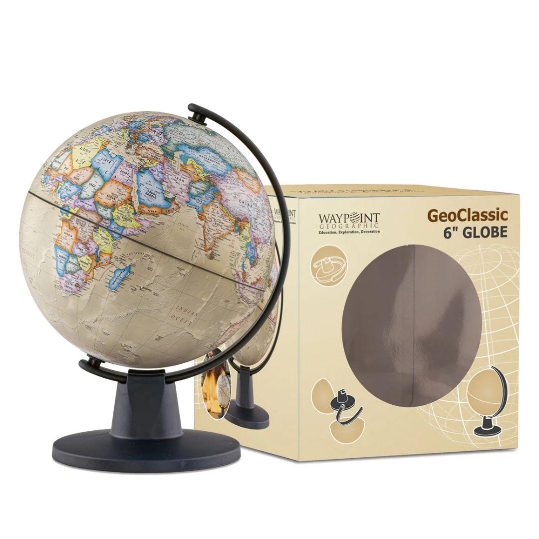 Antique Ocean MiniGlobe by GeoClassic beside its box