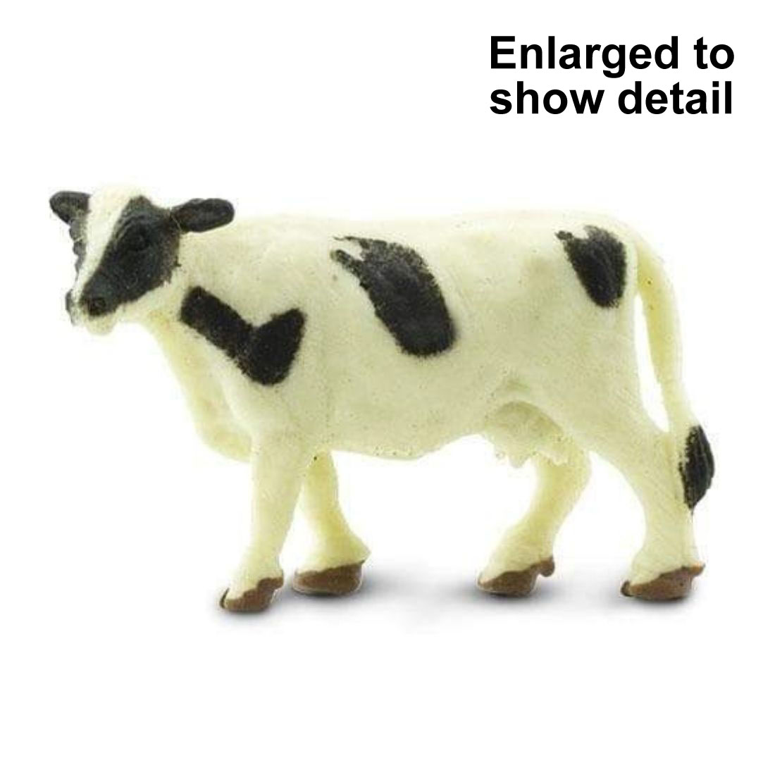 Holstein Cow Mini Figurine with the text Enlarged to Show Detail