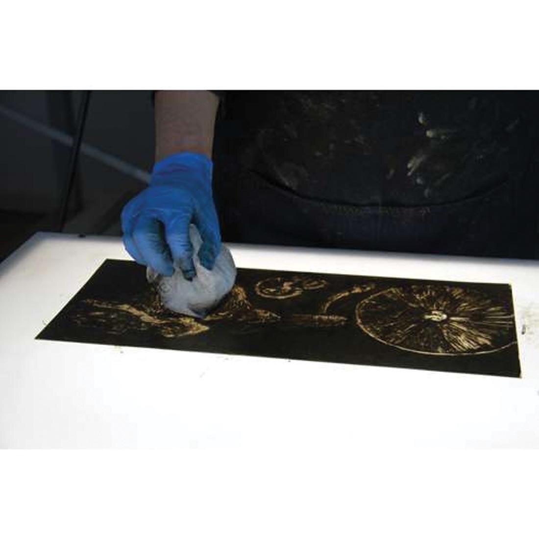 hand in a rubber glove using Akua Wiping Fabric