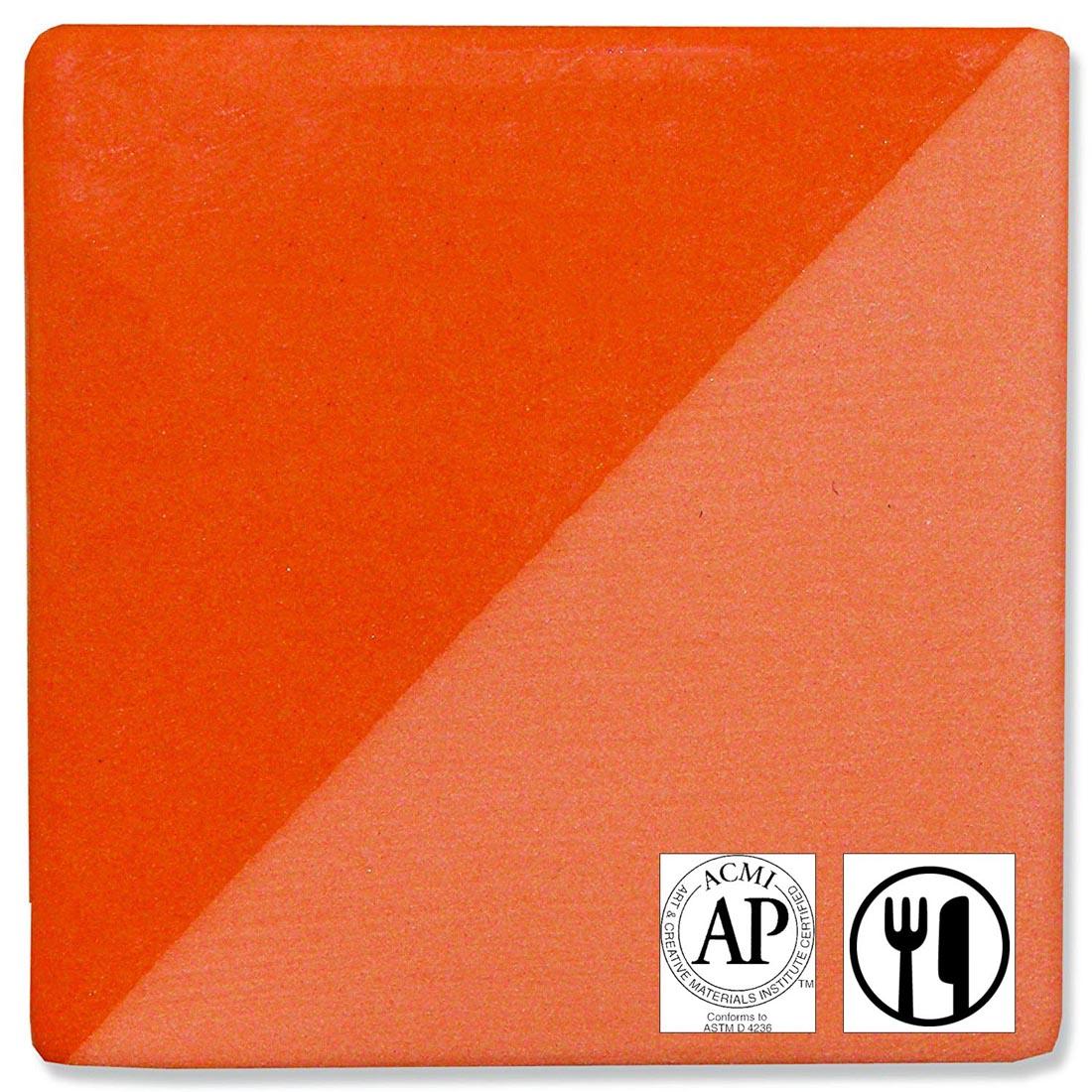 clay tile with Orange Speedball Ceramic Underglaze applied; symbols for AP Seal and food safe