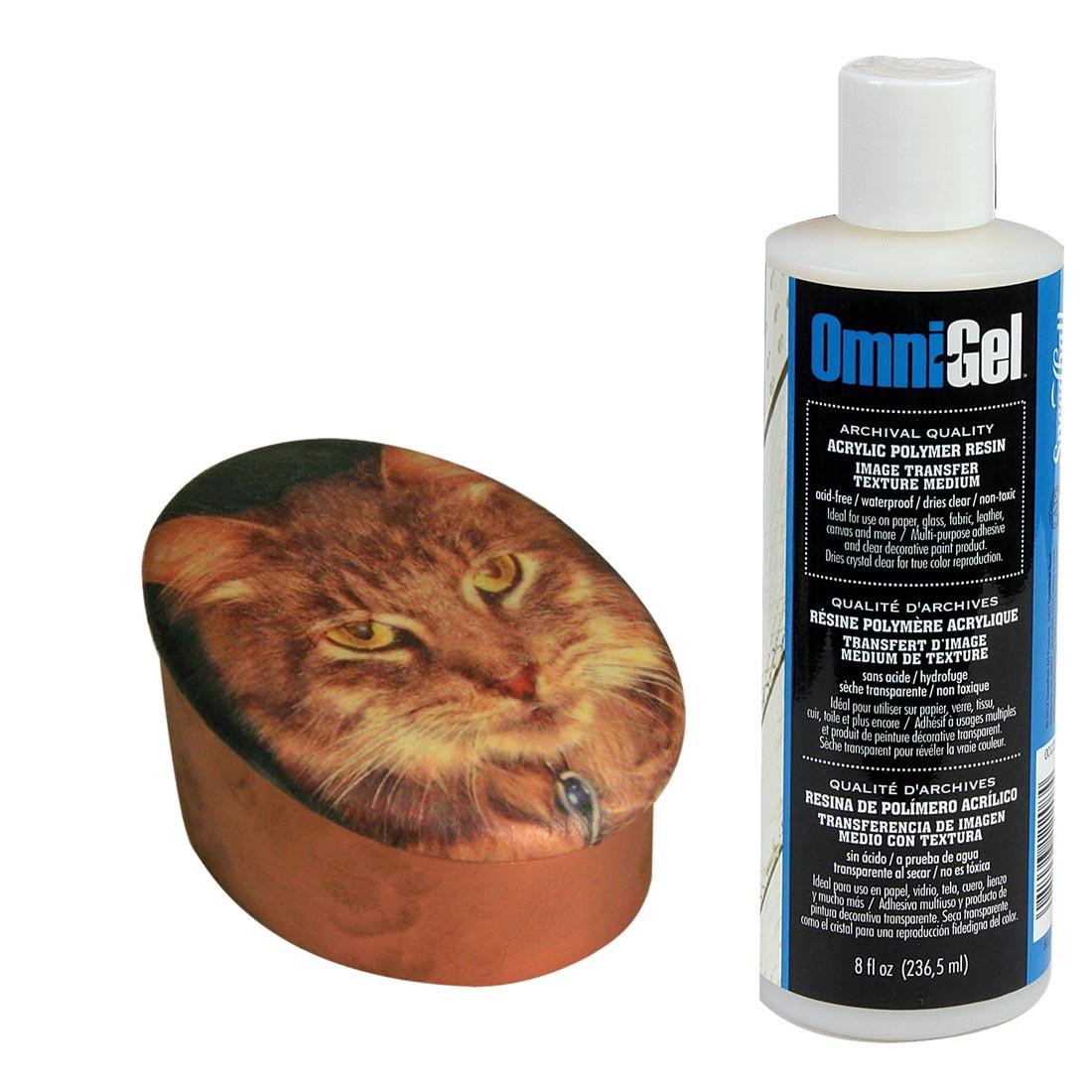 bottle of Omni-Gel Transfer Medium beside a cat-face project that used it