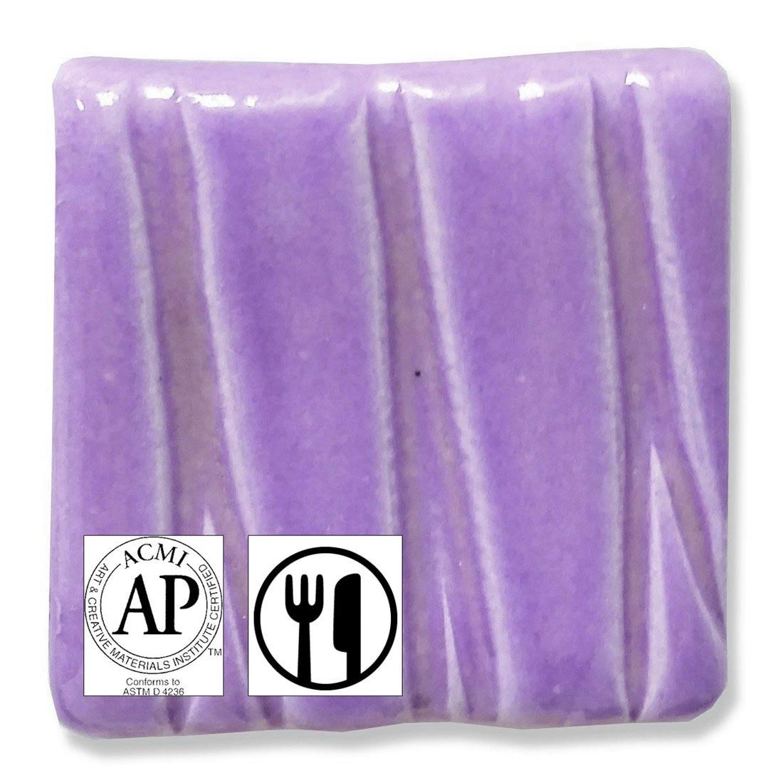 clay tile with Violet Speedball Low Fire Earthenware Glaze applied; symbols for AP Seal and food safe