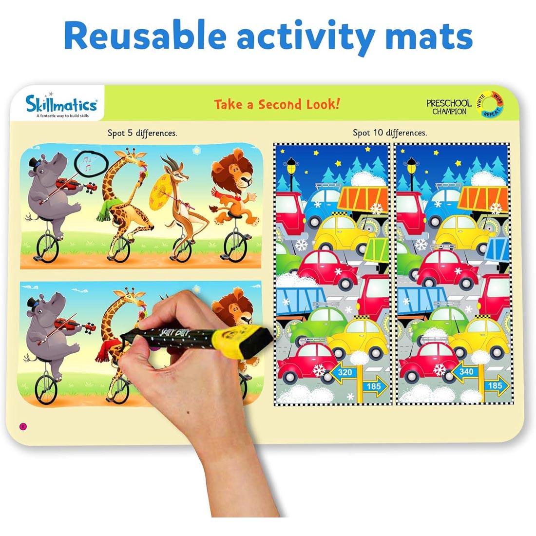 hand drawing on one of the Preschool Champion Write And Wipe Activity Mats By Skillmatics plus text: Reusable activity mats