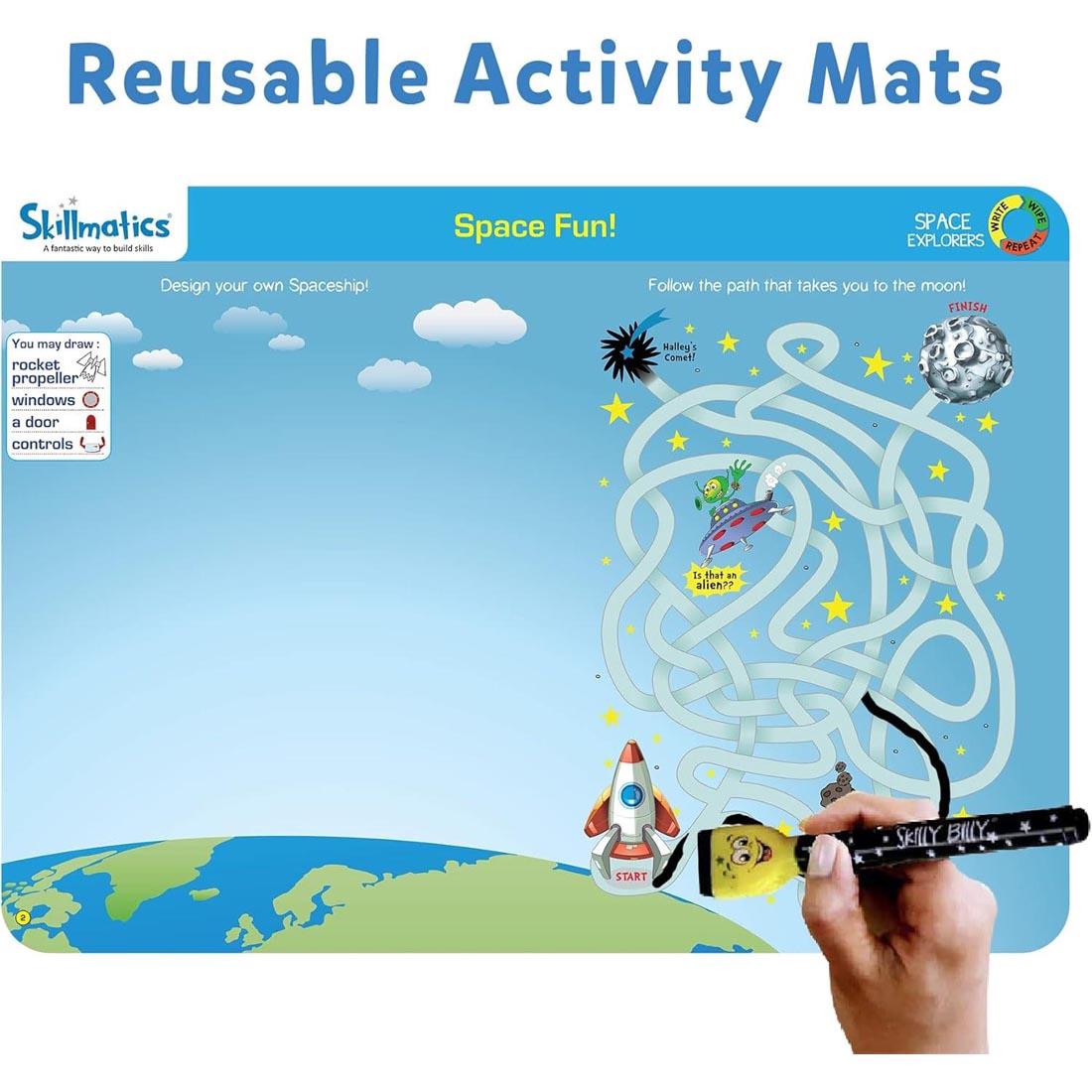 hand erasing from one of the Space Explorers Write And Wipe Activity Mats By Skillmatics plus text: Reusable Activity Mats