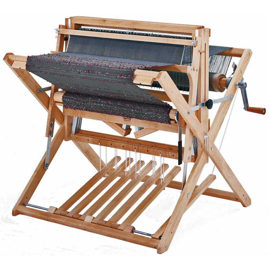 Schacht Spindle Co. 4-Shaft Baby Wolf Loom shown with a weaving already on it