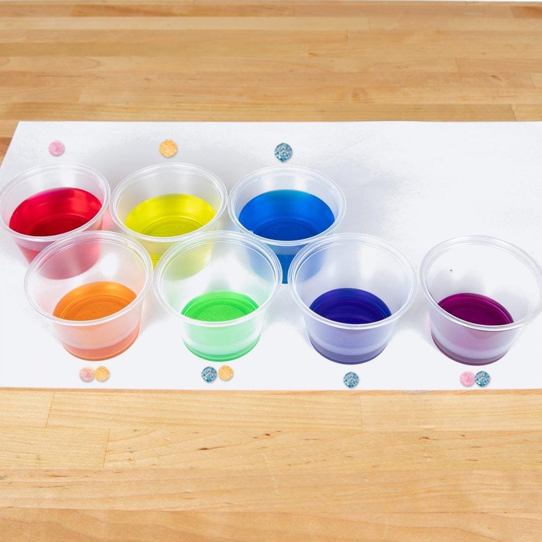 Cups of colored water created with Color Fizzing Tablets By Steve Spangler Science