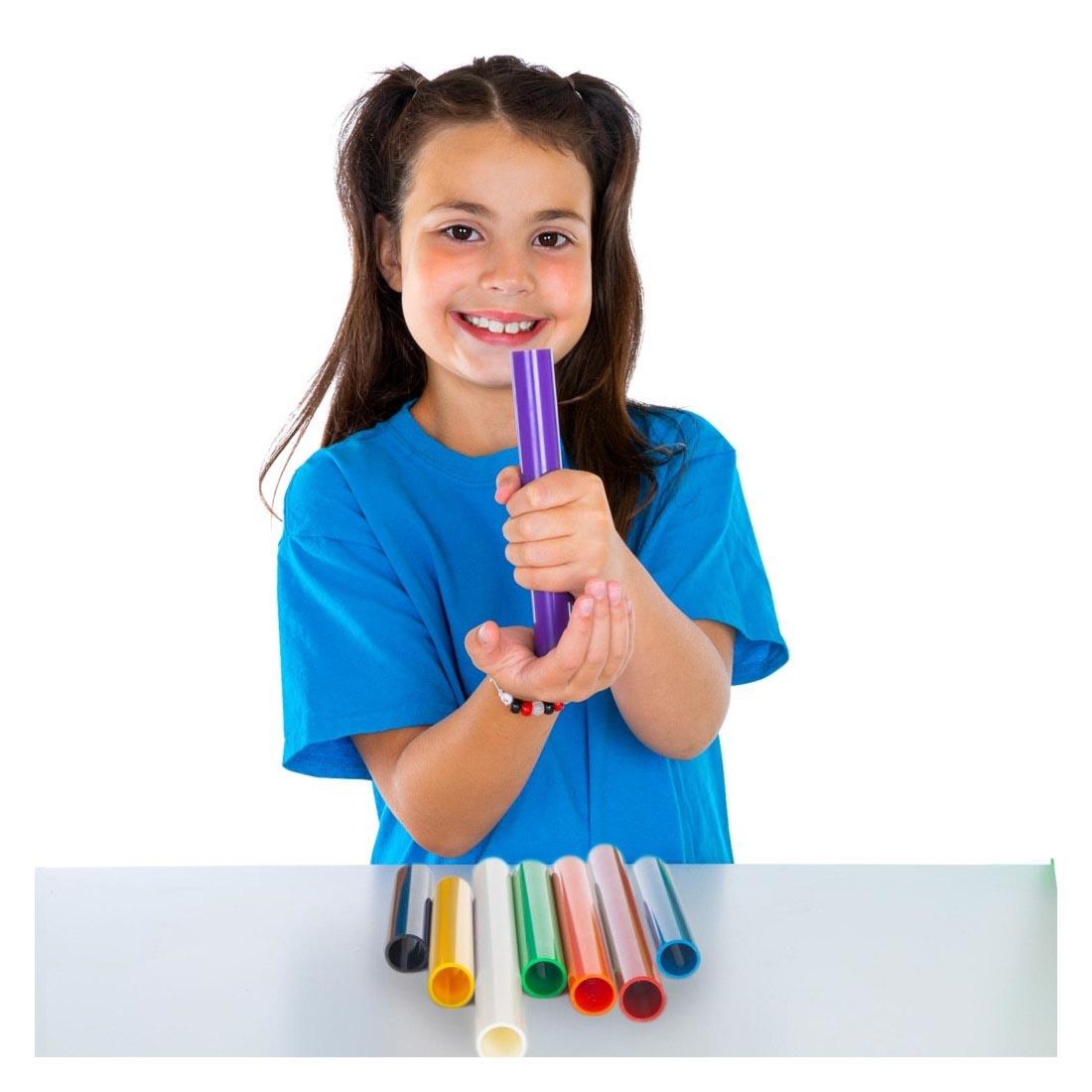 Child playing with Palm Pipes By Steve Spangler Science