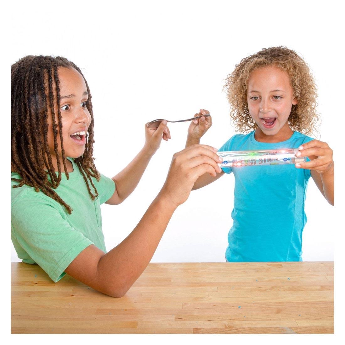 Children playing with the Energy Stick Conductor Set By Steve Spangler Science